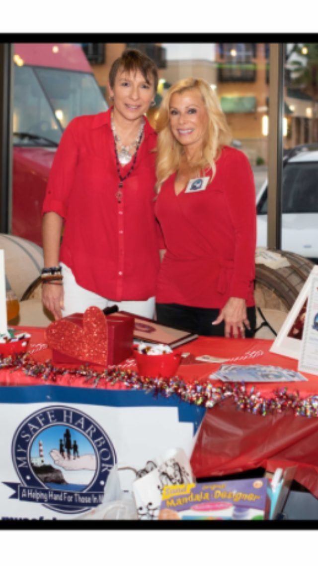 Marsha Tessler and Karen Rogowski of My Safe Harbor, both wearing red